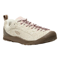 A Keen brand low-top sneaker in a cream knit upper with brown suede overlays, brown laces, and a brown sole, shown from a three-quarters angle on a white background.