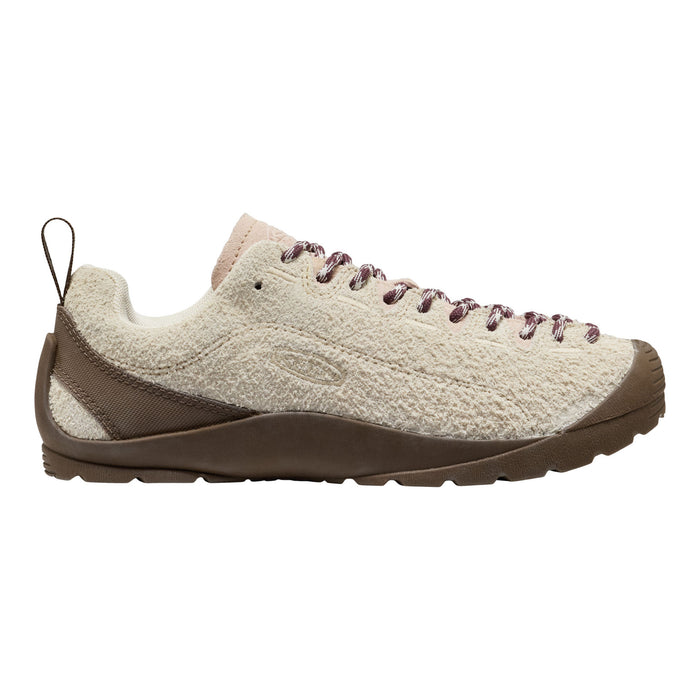 A single low-top shoe shown in side profile on a plain white background. The upper is a textured cream/off-white knit or boucle-like material, with medium brown overlays around the heel and toe, matching brown laces, and a brown outsole.
