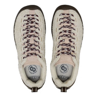 A pair of Keen boots shown from a top-down view, featuring a cream sherpa-lined suede upper, beige laces with dark speckles, and a dark brown rubber toe cap.