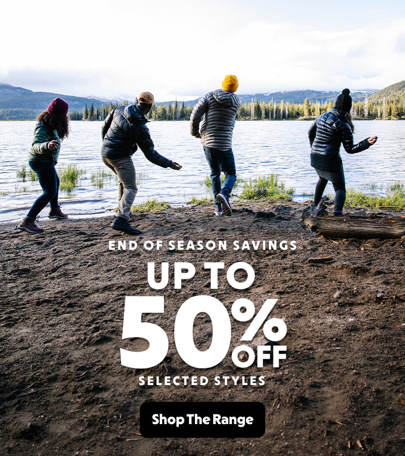 Four people standing on a lakeside with promotional text overlay for end-of-season savings.