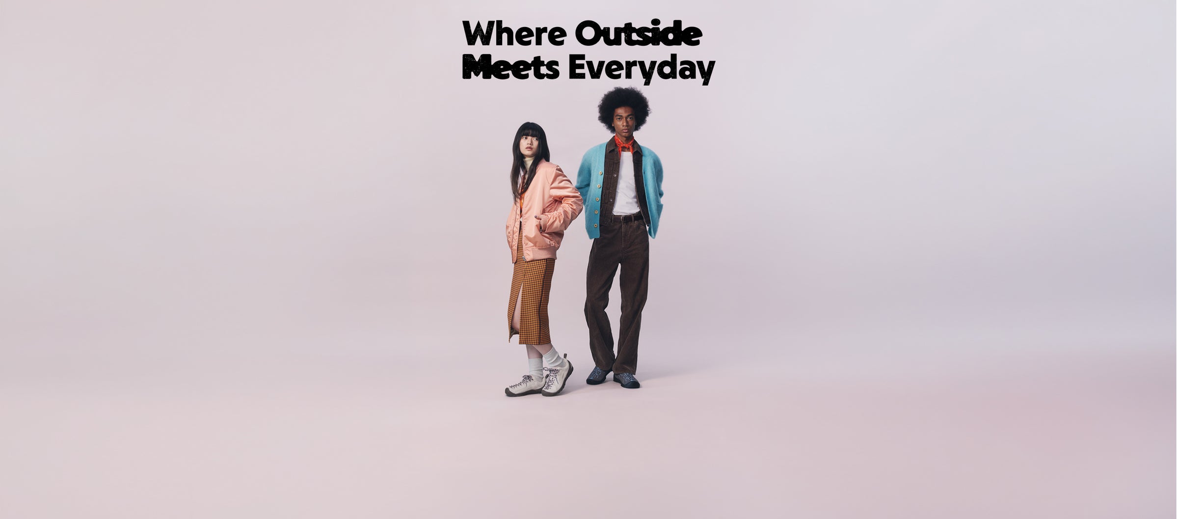Two models standing in a studio setting with the text 'Where Outside Meets Everyday' at the top. The model on the left wears a light pink jacket, brown skirt, and white sneakers.