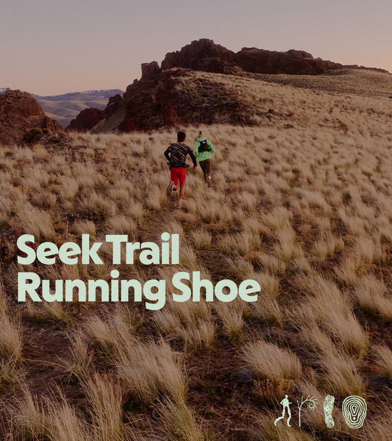 Two people hiking on a rocky trail with 'SeekTrail Running Shoe' text overlay.