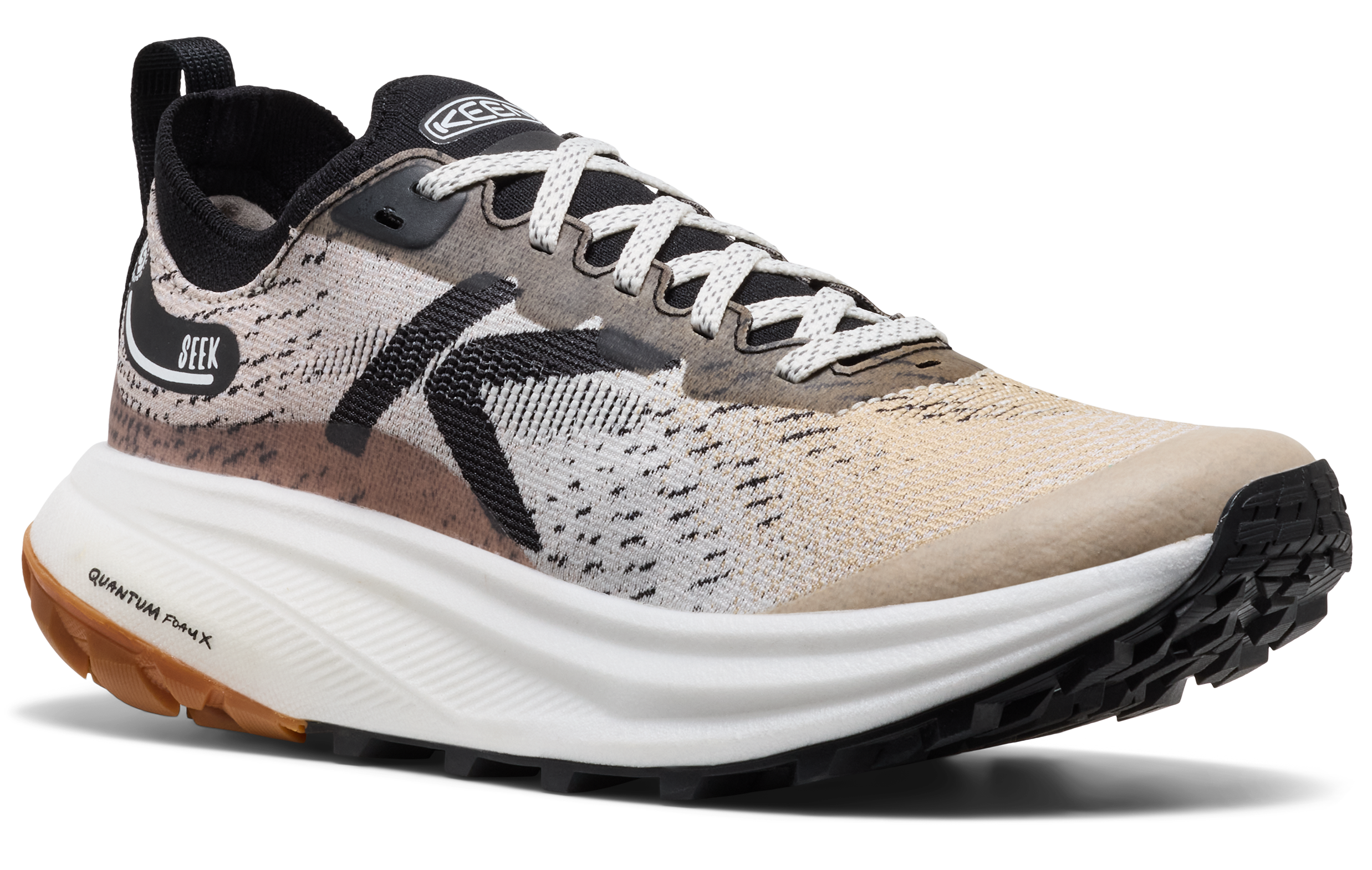 A single running shoe shown in a clean studio-style side angle on a white background. The upper is a knit mix of beige, cream, black, and brown tones, with a thick white midsole and black outsole.